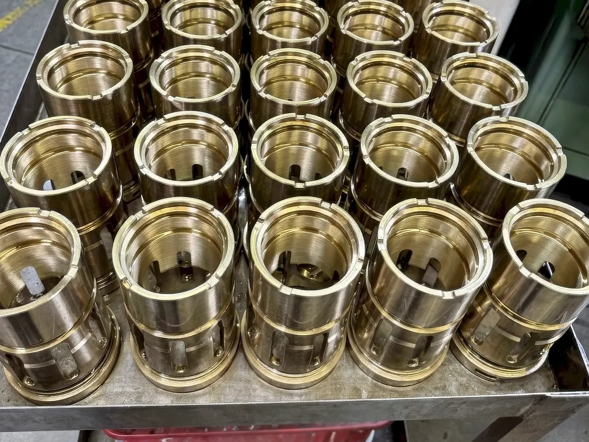 Cart of finished bronze cage bushings