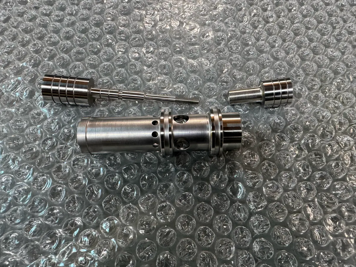 Stainless valve sleeve and metering spool set on bubble wrap